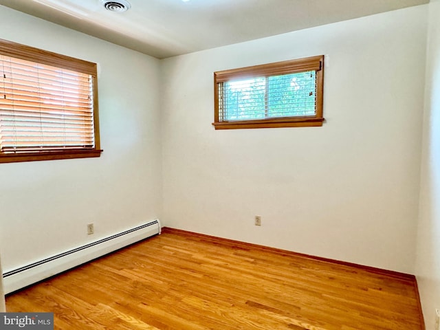 13709 Fir Tree Ln, Cresaptown, MD 21502 - spare room with a baseboard heating unit and light wood finished floors