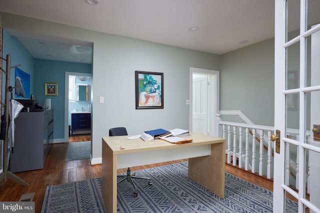 3238 P St NW, Washington, DC 20007 - home office with dark wood-type flooring and baseboards