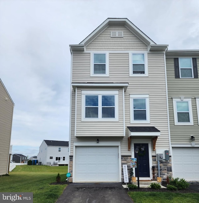 109 Zander Rd, Inwood, WV 25428 - view of front facade featuring driveway, a garage, a front yard, and stone siding