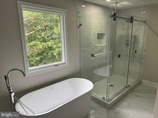10408 Carlyn Ridge Rd, Damascus, MD 20872 - bathroom featuring marble look tiles, a soaking tub, a marble finish shower, and plenty of natural light
