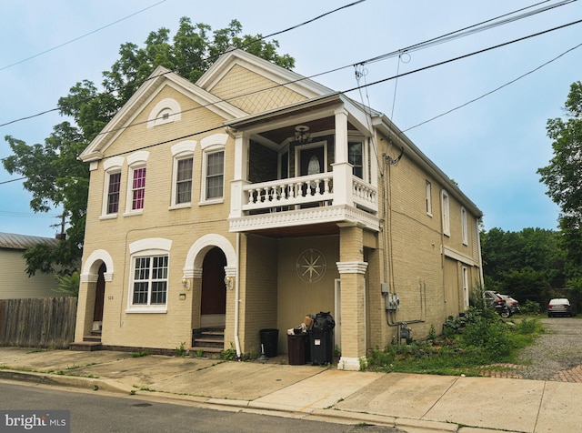 328 N Mechanic St, Cumberland, MD 21502 - view of front of house with a balcony, entry steps, and brick siding