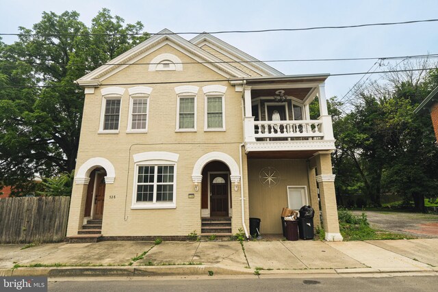328 N Mechanic St, Cumberland, MD 21502 - view of front of property with a balcony, entry steps, and brick siding