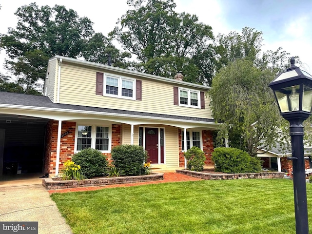 6702 Red Jacket Rd, Springfield, VA 22152 - traditional-style home with a front lawn, brick siding, and a chimney