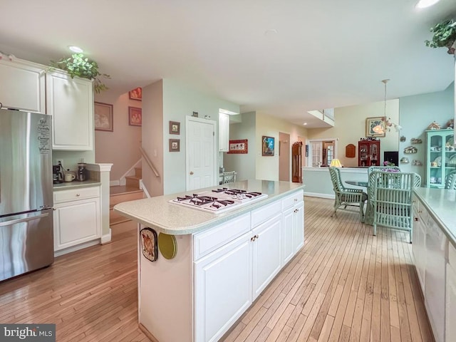 19 Pheasant Run Rd, New Hope, PA 18938 - kitchen with freestanding refrigerator, light wood finished floors, light countertops, white cabinetry, and recessed lighting