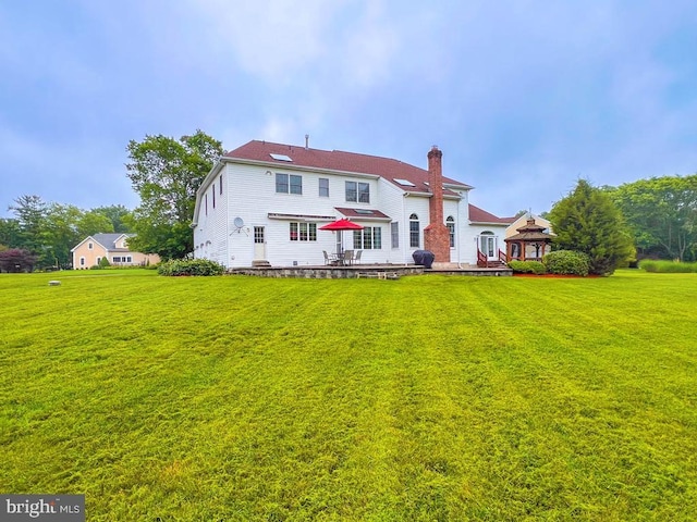 19 Pheasant Run Rd, New Hope, PA 18938 - back of property featuring a gazebo, a yard, a chimney, and a patio