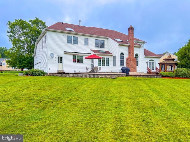 19 Pheasant Run Rd, New Hope, PA 18938 - back of property with a gazebo, a lawn, and a patio area