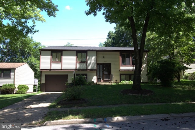 6335 Windharp Way, Columbia, MD 21045 - bi-level home with driveway, an attached garage, and a front lawn