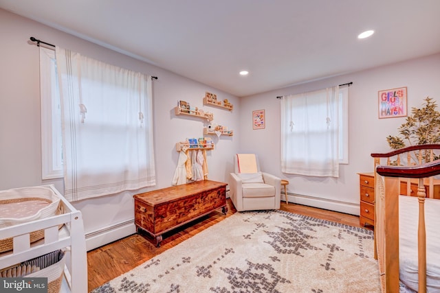 215 Murray Dr, Doylestown, PA 18901 - bedroom with a baseboard heating unit, wood finished floors, and recessed lighting