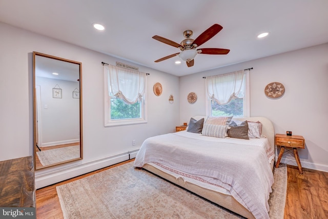 215 Murray Dr, Doylestown, PA 18901 - bedroom featuring baseboard heating, light wood-style flooring, recessed lighting, and a ceiling fan