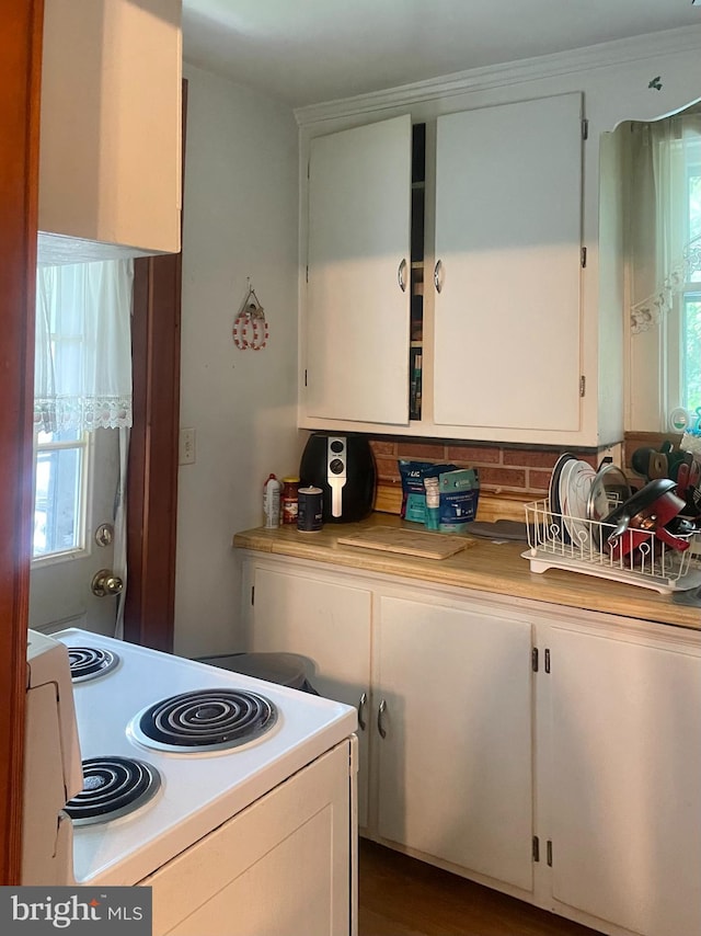 531 Winifred Rd, Cumberland, MD 21502 - kitchen with electric range, white cabinetry, light countertops, and tasteful backsplash