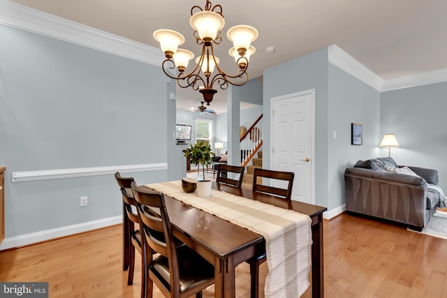810 Broken Twig Ct, Odenton, MD 21113 - dining space featuring light wood-type flooring, a chandelier, stairway, and ornamental molding
