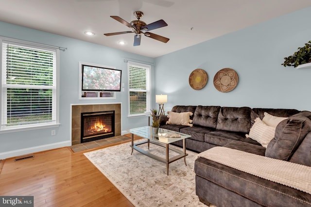 810 Broken Twig Ct, Odenton, MD 21113 - living area with a ceiling fan, wood finished floors, a tile fireplace, and recessed lighting