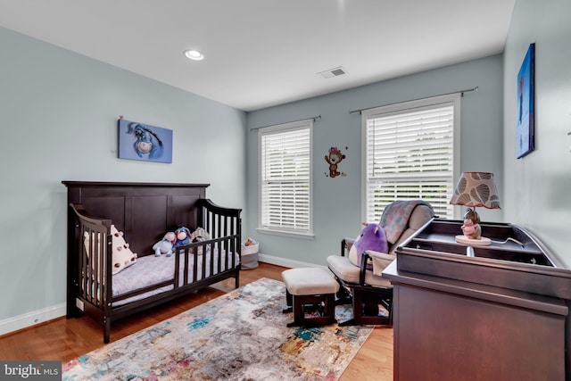 810 Broken Twig Ct, Odenton, MD 21113 - bedroom featuring wood finished floors, recessed lighting, and a nursery area
