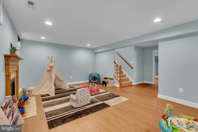 810 Broken Twig Ct, Odenton, MD 21113 - recreation room with wood finished floors, recessed lighting, and a fireplace