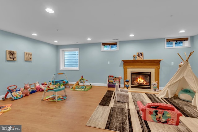 810 Broken Twig Ct, Odenton, MD 21113 - playroom with wood finished floors, recessed lighting, and a glass covered fireplace