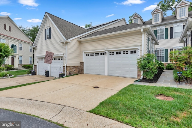 810 Broken Twig Ct, Odenton, MD 21113 - view of front facade with concrete driveway, stone siding, an attached garage, and roof with shingles