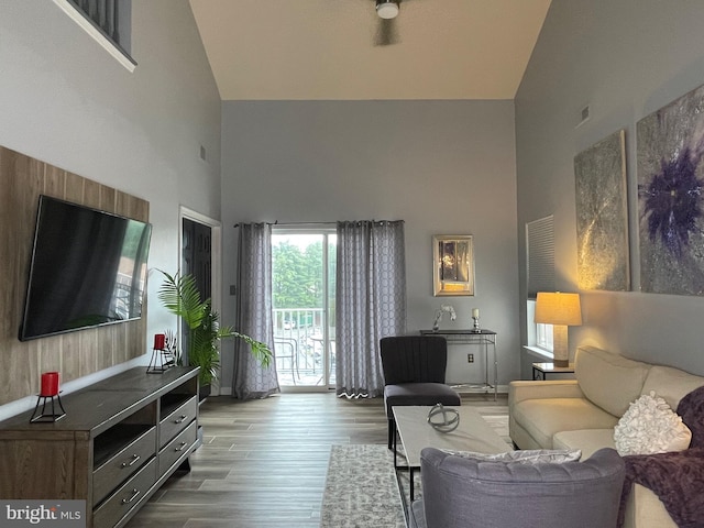 8 Tyler Falls Ct Unit C, Baltimore, MD 21209 - living room featuring high vaulted ceiling and wood finished floors
