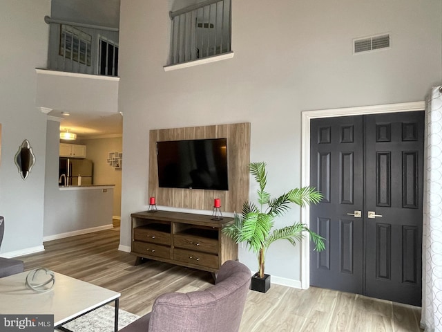 8 Tyler Falls Ct Unit C, Baltimore, MD 21209 - living room with wood finished floors and a high ceiling