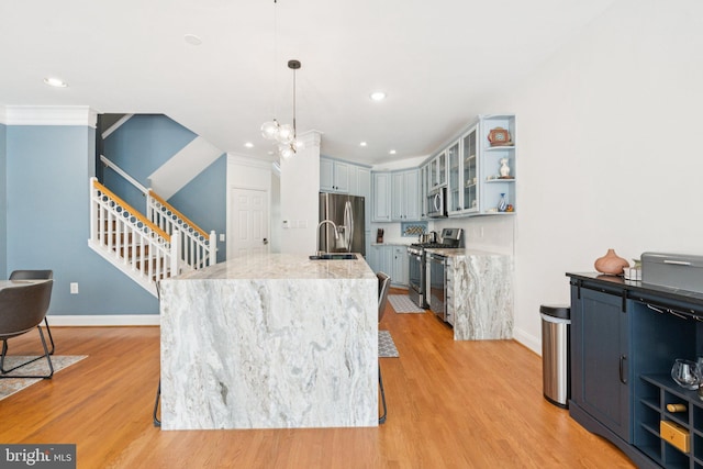 2009 Magarity Ct, Falls Church, VA 22043 - kitchen featuring appliances with stainless steel finishes, open shelves, light wood-type flooring, glass insert cabinets, and light stone countertops