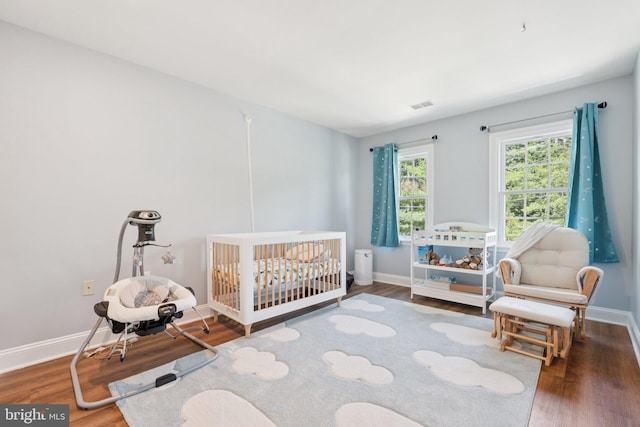 2009 Magarity Ct, Falls Church, VA 22043 - bedroom featuring wood finished floors and a crib