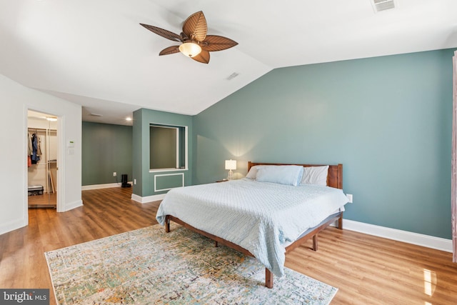2009 Magarity Ct, Falls Church, VA 22043 - bedroom with wood finished floors, a walk in closet, lofted ceiling, ceiling fan, and a closet