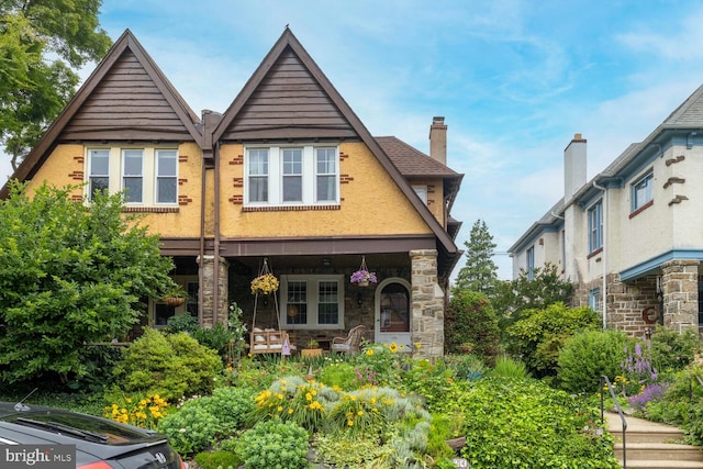 627 E Allens Ln, Philadelphia, PA 19119 - view of front of property featuring stone siding and a chimney