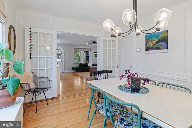 627 E Allens Ln, Philadelphia, PA 19119 - dining area featuring light wood-style flooring, a ceiling fan, ornamental molding, a chandelier, and french doors