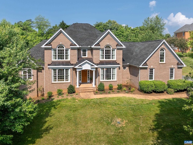 455 Foxdale Ln, Charlottesville, VA 22903 - traditional-style home featuring brick siding, a front yard, and roof with shingles