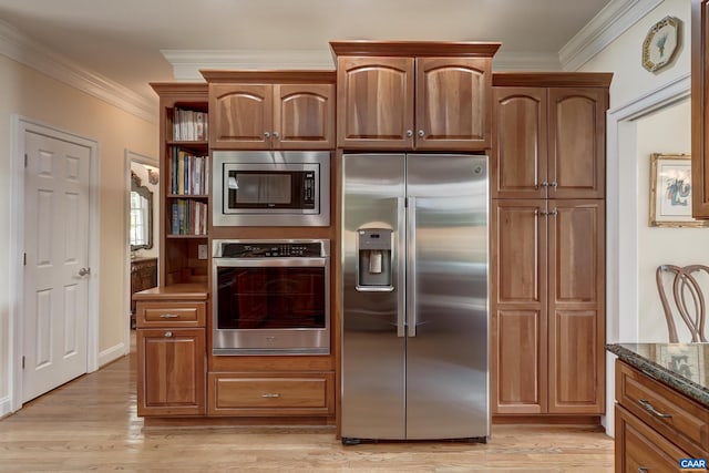 455 Foxdale Ln, Charlottesville, VA 22903 - kitchen featuring appliances with stainless steel finishes, crown molding, light wood-style flooring, dark stone countertops, and open shelves