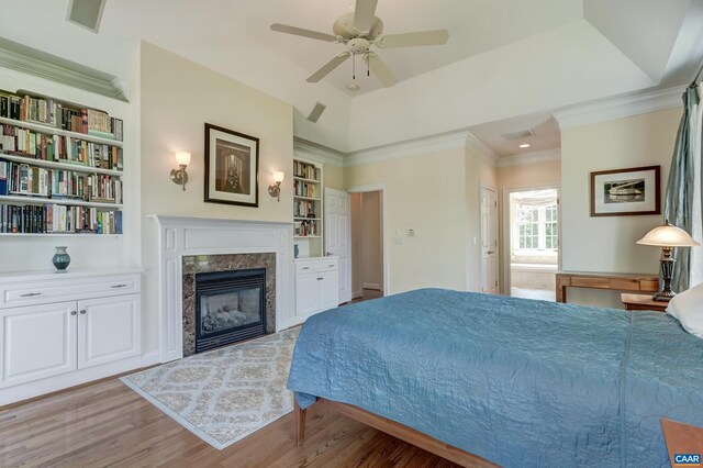 455 Foxdale Ln, Charlottesville, VA 22903 - bedroom with wood finished floors, a fireplace, crown molding, ensuite bathroom, and ceiling fan