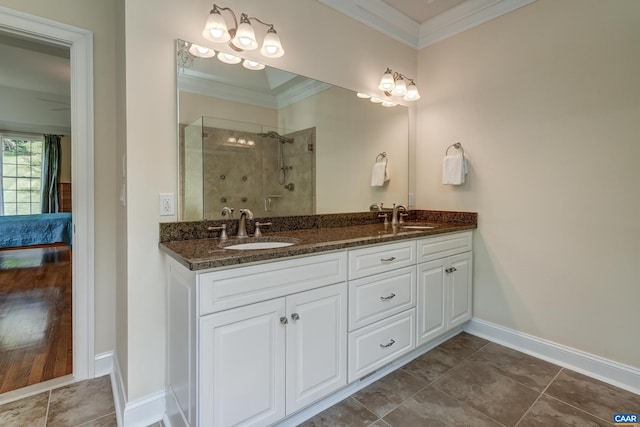 455 Foxdale Ln, Charlottesville, VA 22903 - ensuite bathroom featuring double vanity, a shower stall, crown molding, and tile patterned flooring