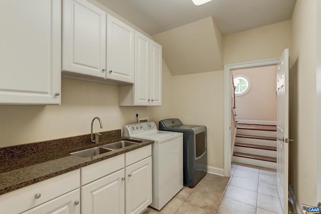 455 Foxdale Ln, Charlottesville, VA 22903 - laundry room featuring washing machine and clothes dryer, cabinet space, and light tile patterned floors
