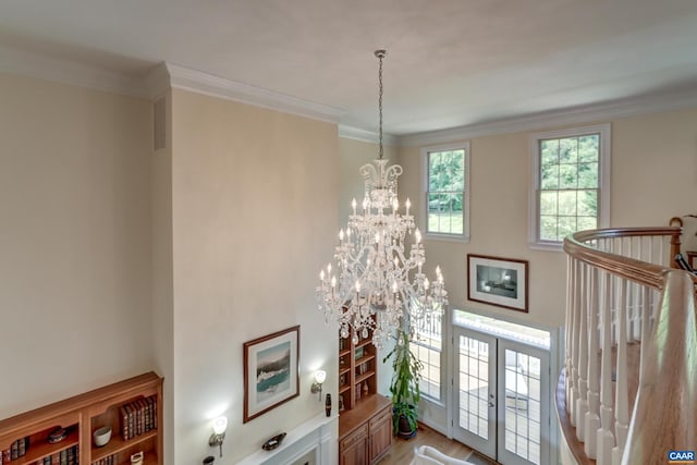 455 Foxdale Ln, Charlottesville, VA 22903 - foyer featuring a chandelier, light wood-style flooring, and ornamental molding