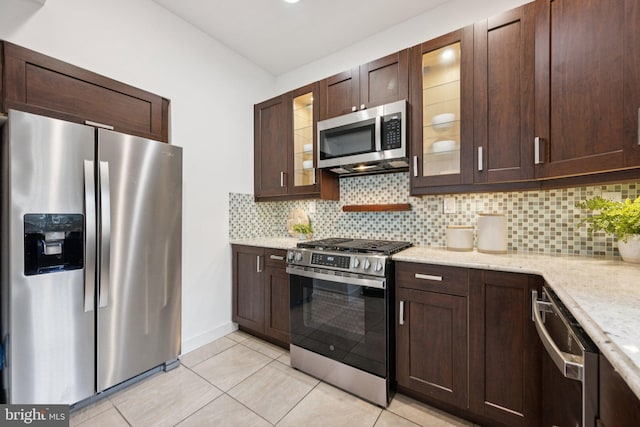 1200 6th St NE, Washington, DC 20002 - kitchen with stainless steel appliances, dark brown cabinets, and backsplash