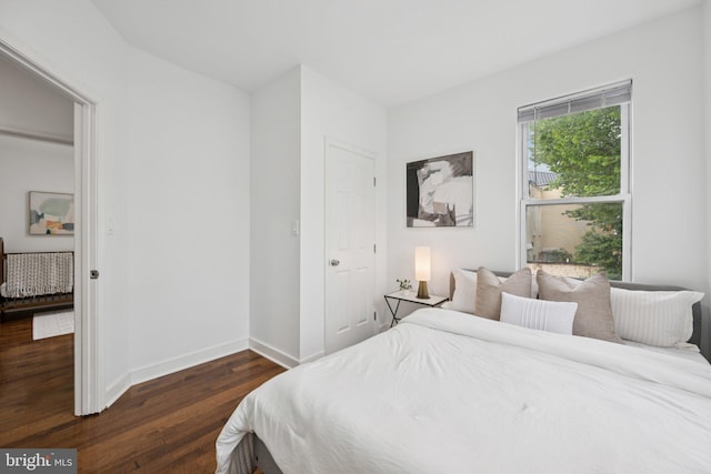 1200 6th St NE, Washington, DC 20002 - bedroom featuring dark wood-type flooring and baseboards