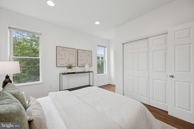 1200 6th St NE, Washington, DC 20002 - bedroom featuring multiple windows, dark wood-style floors, a closet, and recessed lighting