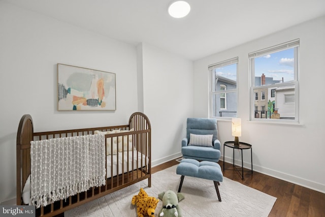 1200 6th St NE, Washington, DC 20002 - bedroom with wood finished floors and a nursery area