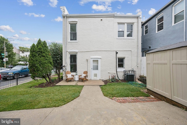 1200 6th St NE, Washington, DC 20002 - rear view of property with a storage shed and brick siding