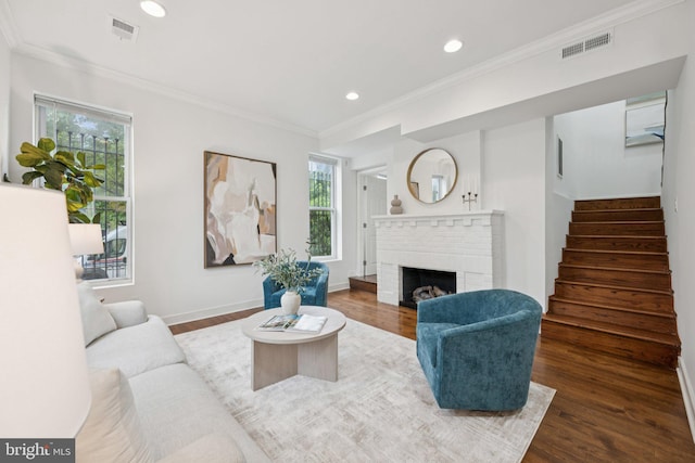 1200 6th St NE, Washington, DC 20002 - living area featuring wood finished floors, stairway, recessed lighting, a brick fireplace, and crown molding