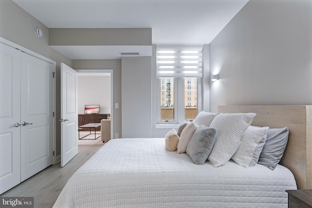 155 Potomac Psge Unit 237, National Harbor, MD 20745 - bedroom featuring light wood-style floors and a closet