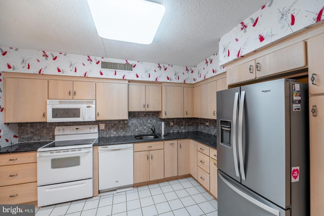20630 Valley Forge Cir Unit 630, King Of Prussia, PA 19406 - kitchen with white appliances, light brown cabinetry, backsplash, dark countertops, and a textured ceiling
