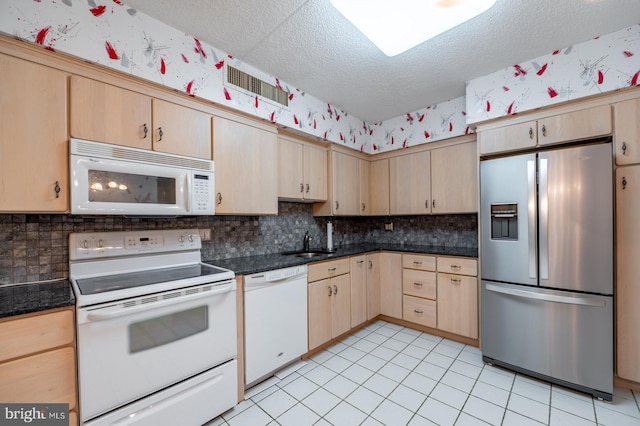 20630 Valley Forge Cir Unit 630, King Of Prussia, PA 19406 - kitchen with white appliances, light brown cabinets, a textured ceiling, dark countertops, and backsplash