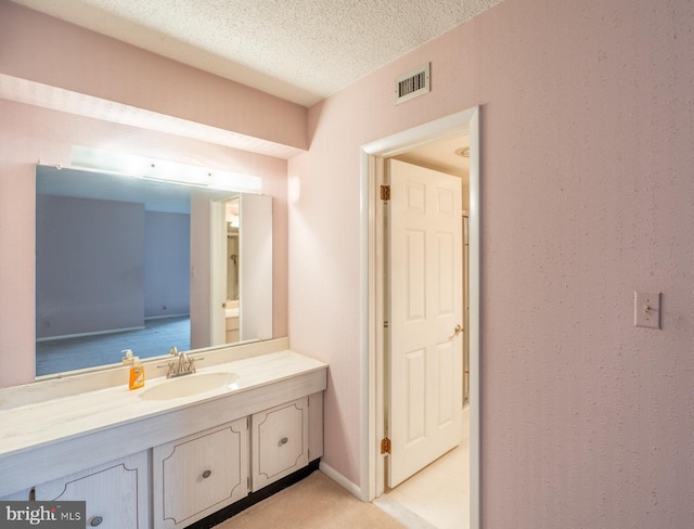 20630 Valley Forge Cir Unit 630, King Of Prussia, PA 19406 - bathroom featuring vanity and a textured ceiling