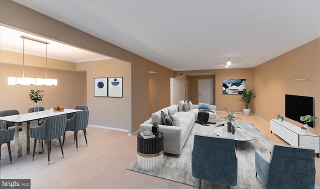 20630 Valley Forge Cir Unit 630, King Of Prussia, PA 19406 - living area with a chandelier and light carpet