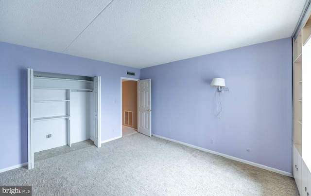 20630 Valley Forge Cir Unit 630, King Of Prussia, PA 19406 - unfurnished bedroom with carpet floors, a textured ceiling, and a closet