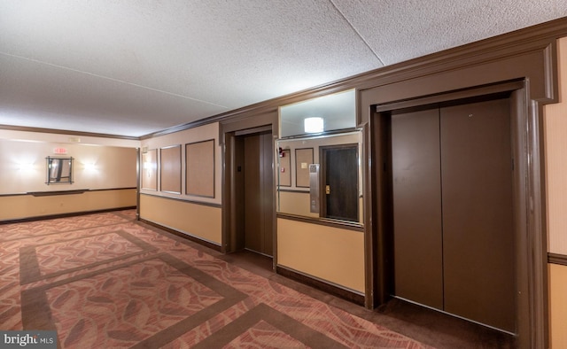 20630 Valley Forge Cir Unit 630, King Of Prussia, PA 19406 - hallway with ornamental molding, elevator, carpet floors, and a textured ceiling