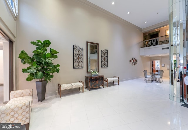 20630 Valley Forge Cir Unit 630, King Of Prussia, PA 19406 - building lobby featuring a high ceiling, ornamental molding, and recessed lighting