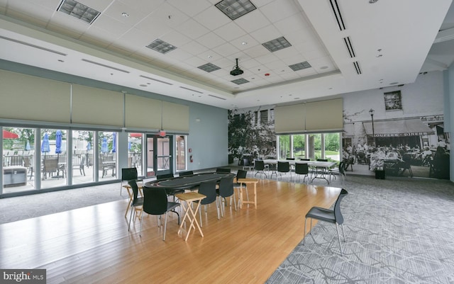 20630 Valley Forge Cir Unit 630, King Of Prussia, PA 19406 - dining space with a high ceiling, a raised ceiling, wood finished floors, and a drop ceiling