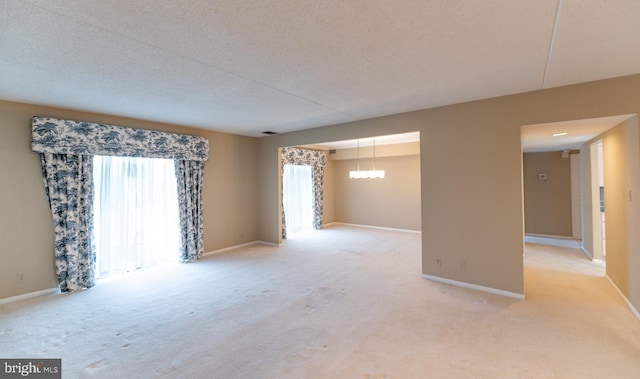 20630 Valley Forge Cir Unit 630, King Of Prussia, PA 19406 - unfurnished room featuring light carpet and a textured ceiling