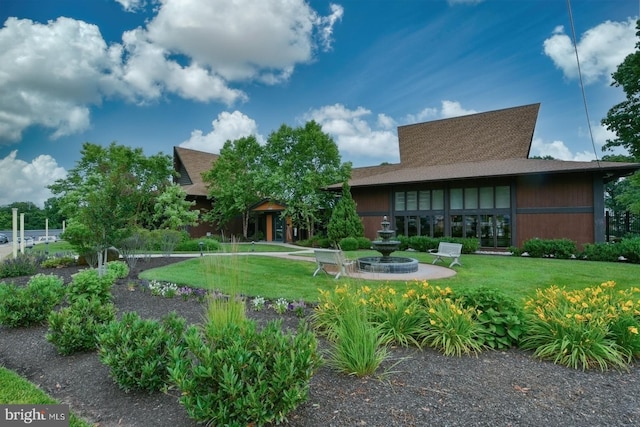 20630 Valley Forge Cir Unit 630, King Of Prussia, PA 19406 - rear view of property featuring a yard and a shingled roof